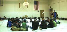 Elder AJ Agard teaches young Lakota